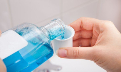 hand-pouring-mouthwash-into-cup-1444331148-600×360